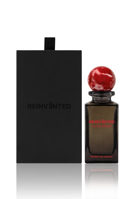 lucid dream perfume bottle by Reinvented Parfums, niche fragrance saffron rose oud, luxury unisex perfume flatlay, dreamy surreal perfume imagery